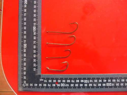 APPROXIMATELY 900 HOOKS (NEVER BEEN USED).